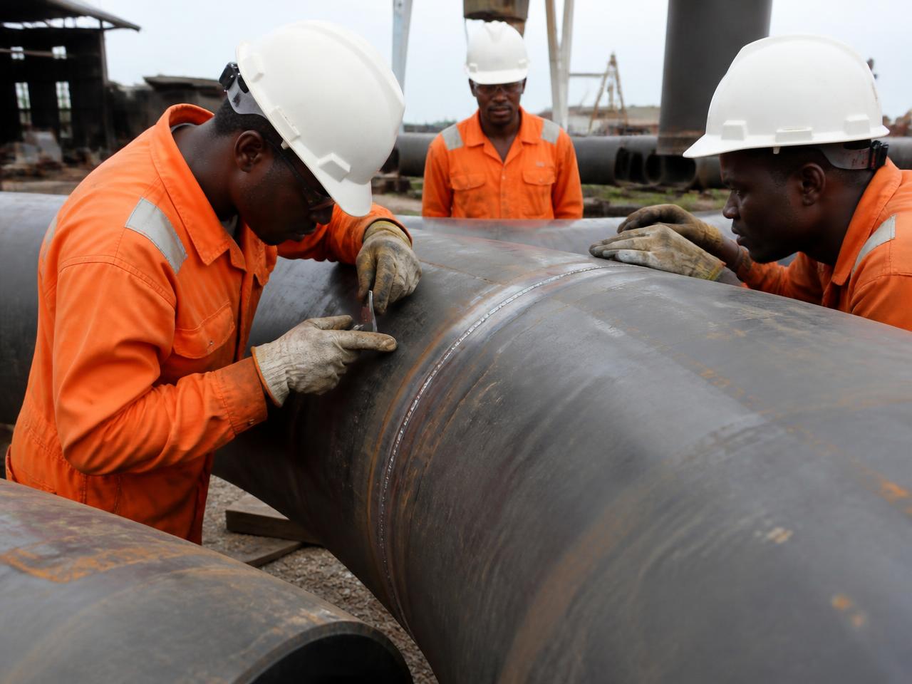 Nibesa Energy engineers inspecting a pipeline weld at a fabrication yard